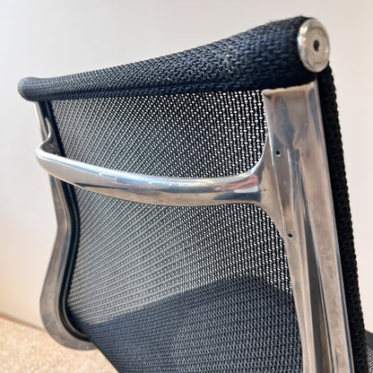 Seat back detail of Eames Aluminium Group Executive Chair by Herman Miller in Black Mesh seat and back