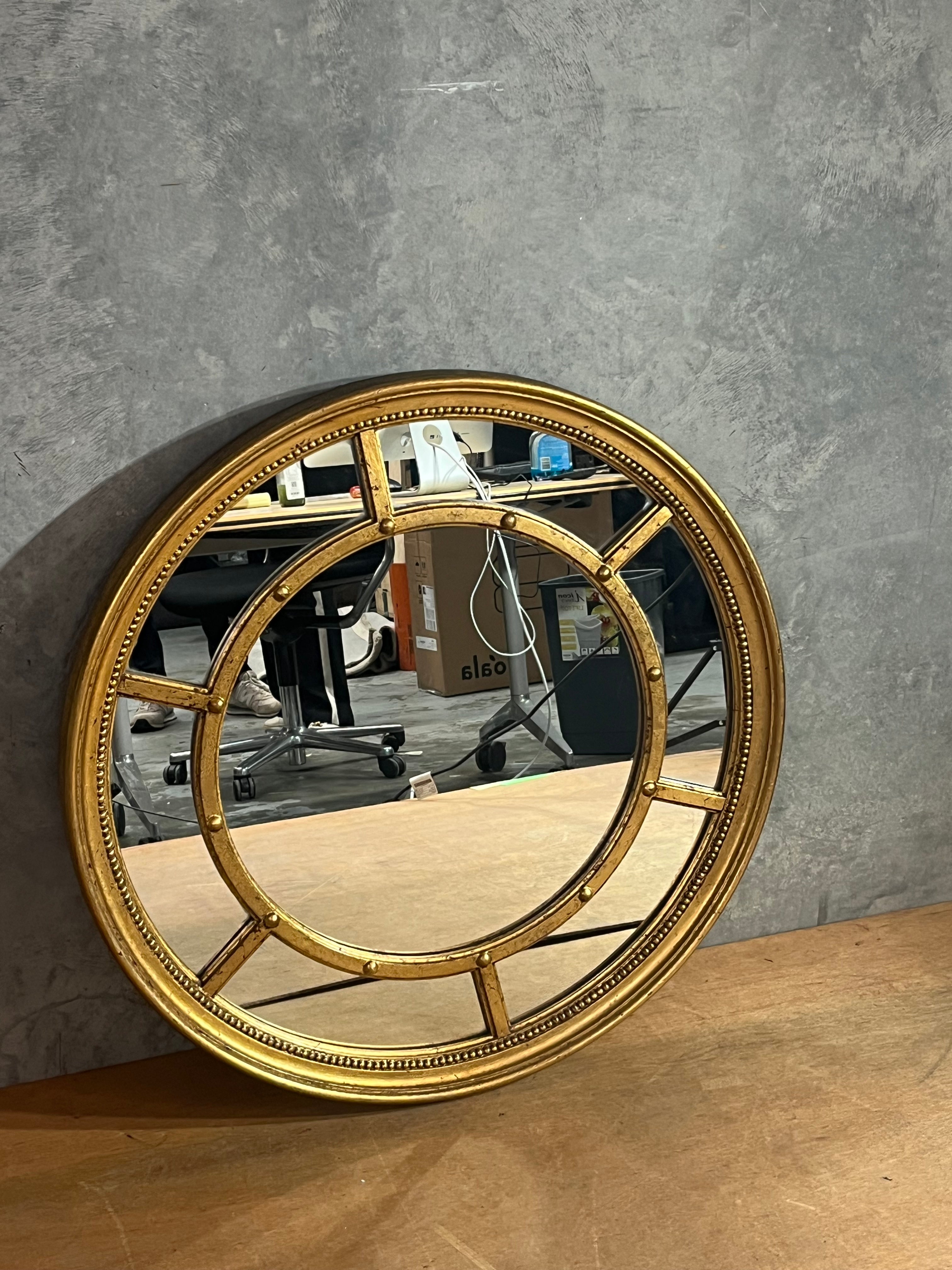Round gold gilded mirror