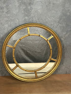 Round gold gilded mirror