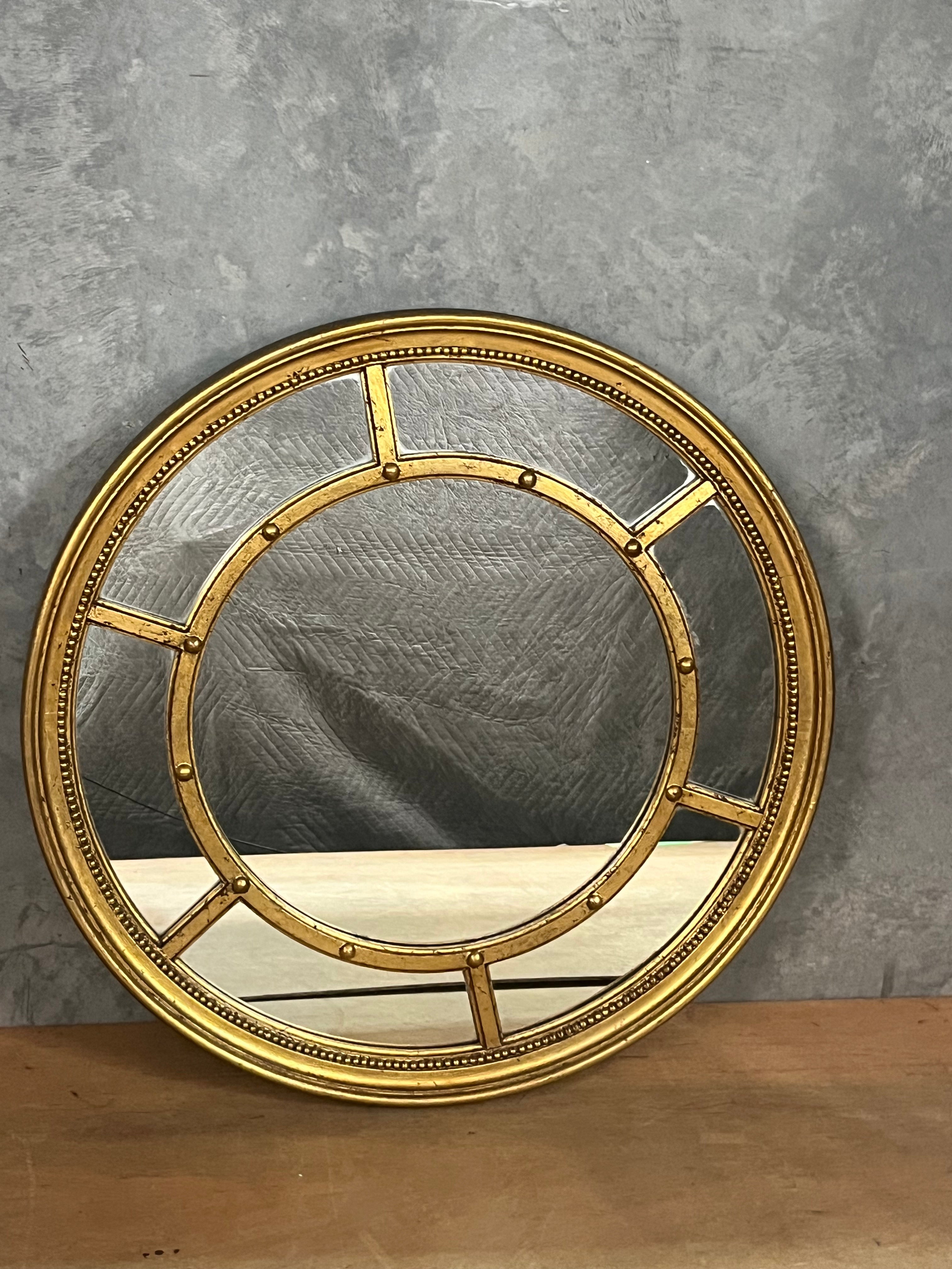 Round gold gilded mirror